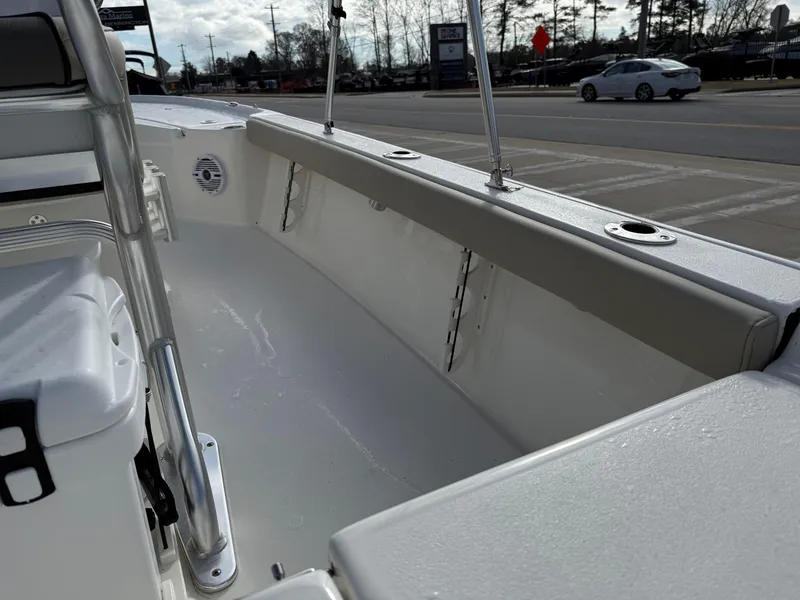 Slide: The Image of 2025 Key West 210 Bay Reef boat interior with seating and rod holders. - 23