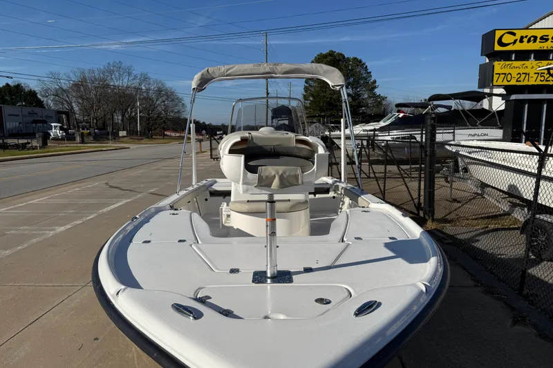 Slide: The Image of 2026 Key West 210 Bay Reef boat displayed outdoors on a sunny day. - 26