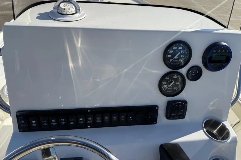Slide: The Image of Dashboard of 2026 Key West 210 Bay Reef boat with gauges and controls. - 29