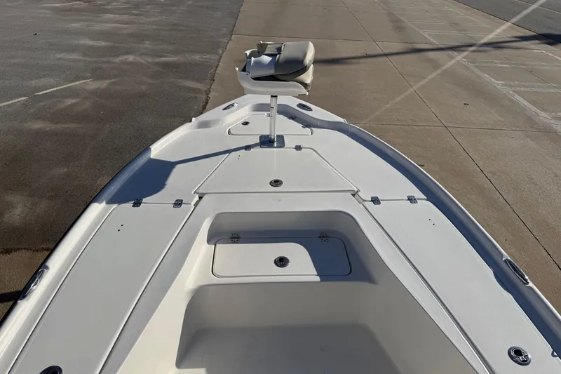 Slide: The Image of 2026 Key West 210 Bay Reef boat deck with seating and storage compartments. - 30