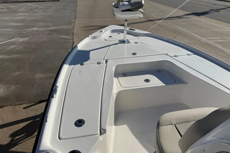 Slide: The Image of 2026 Key West 210 Bay Reef boat deck with seating and storage compartments. - 31