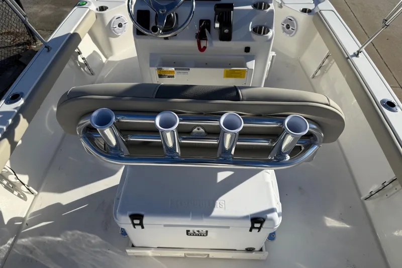 Slide: The Image of 2026 Key West 210 Bay Reef boat interior with rod holders and cooler. - 34