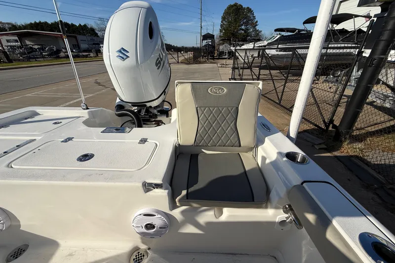 Slide: The Image of 2026 Key West 210 Bay Reef boat with Suzuki engine, featuring cushioned seating and storage compartments. - 36