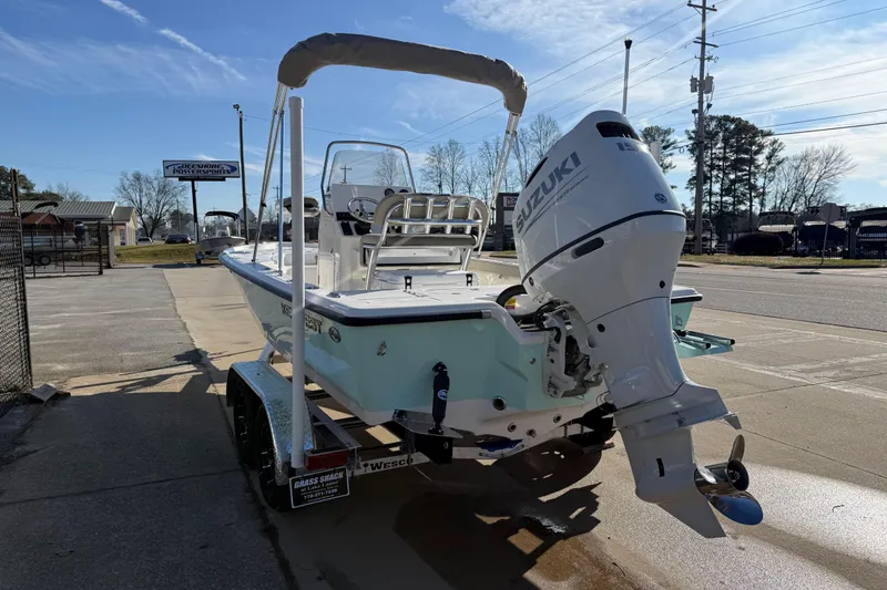 Slide: The Image of 2026 Key West 210 Bay Reef boat with Suzuki outboard motor on trailer. - 4