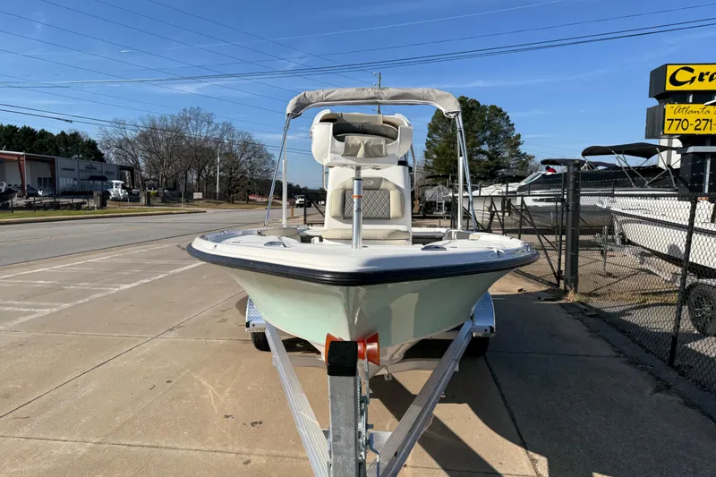 Slide: The Image of 2026 Key West 210 Bay Reef boat on trailer, parked outdoors on a sunny day. - 6