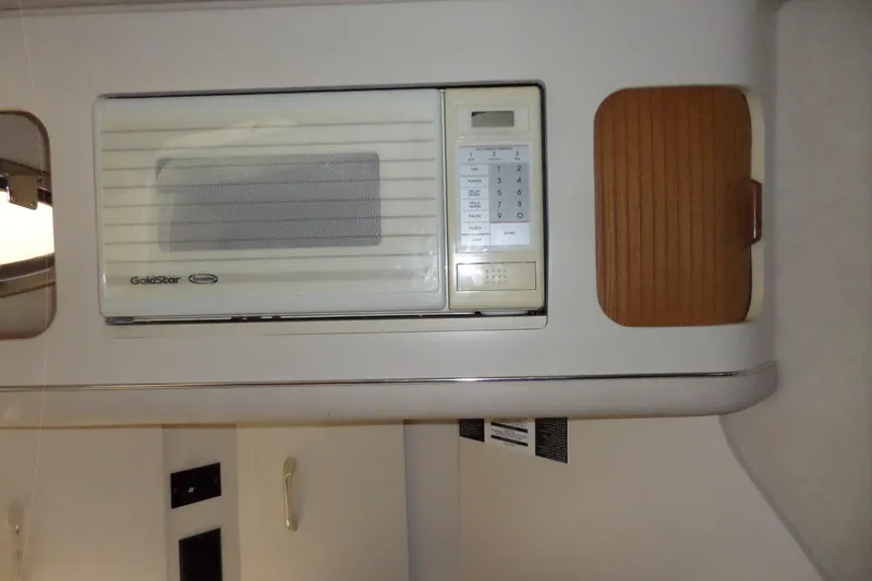 Slide: The Image of 1994 Searay 300 Weekender interior with built-in GoldStar microwave. - 10