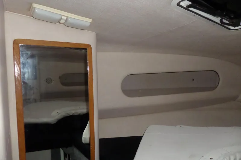Slide: The Image of Interior cabin of 1994 Searay 300 Weekender boat with mirror and lighting. - 17