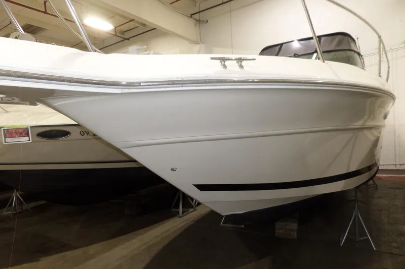 Slide: The Image of 1994 Searay 300 Weekender boat in indoor storage, side view. - 2