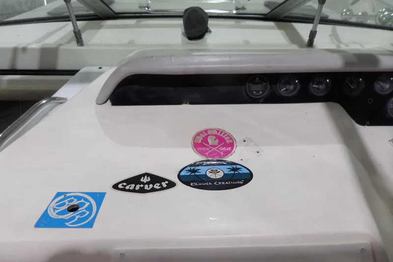 Slide: The Image of 1994 Searay 300 Weekender dashboard with stickers and gauges. - 27
