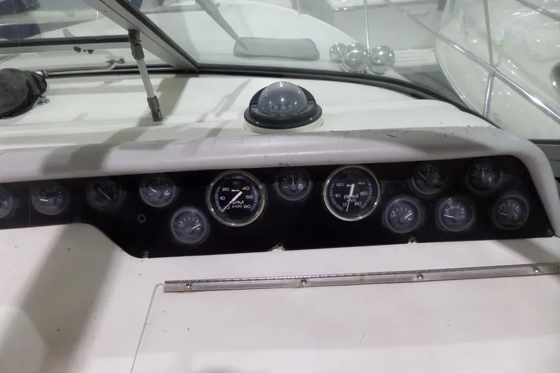 Slide: The Image of 1994 Searay 300 Weekender dashboard with gauges and compass. - 28