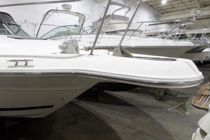 Slide: The Image of 1994 Searay 300 Weekender boat in indoor storage, side view. - 3