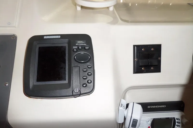 Slide: The Image of Humminbird GPS fishfinder on 1994 Searay 300 Weekender boat dashboard. - 30