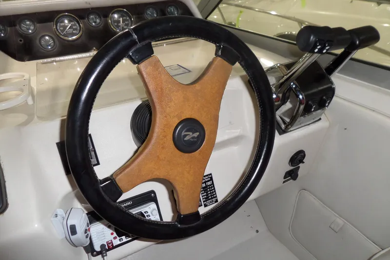 Slide: The Image of 1994 Searay 300 Weekender helm with steering wheel and control panel. - 32