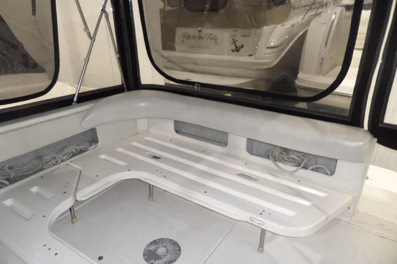 Slide: The Image of 1994 Searay 300 Weekender boat interior with seating and storage compartments. - 36