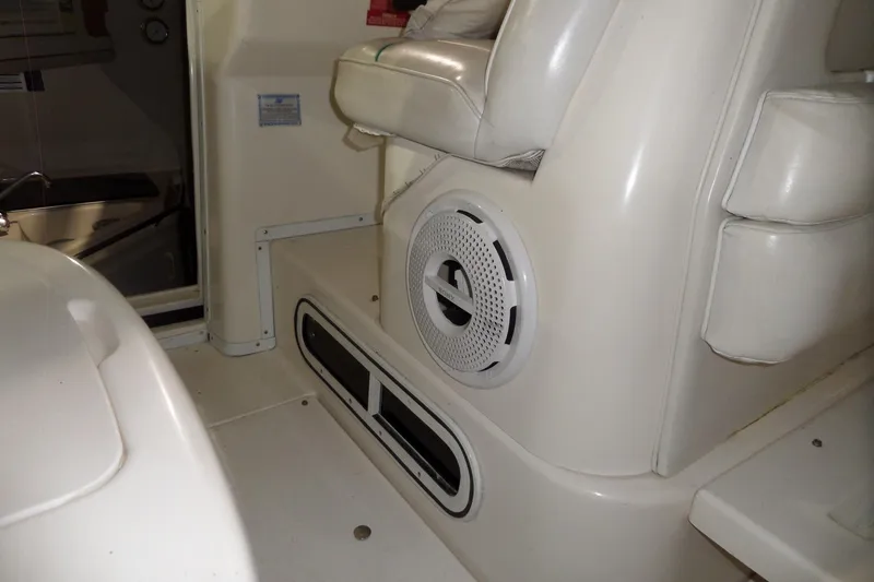 Slide: The Image of 1994 Searay 300 Weekender interior with white seating and speaker detail. - 39