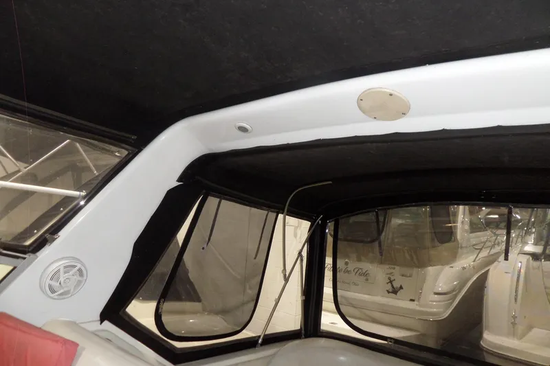 Slide: The Image of Interior view of a 1994 Searay 300 Weekender boat cabin with windows and speaker. - 40