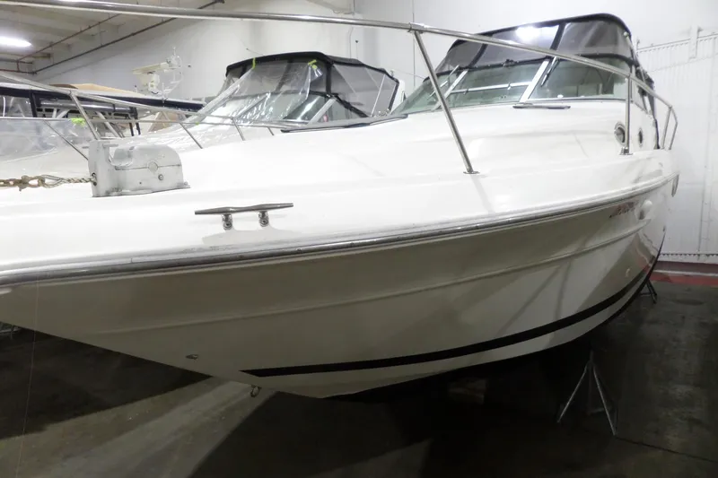 Slide: The Image of 1994 Searay 300 Weekender boat in indoor storage, side view. - 5
