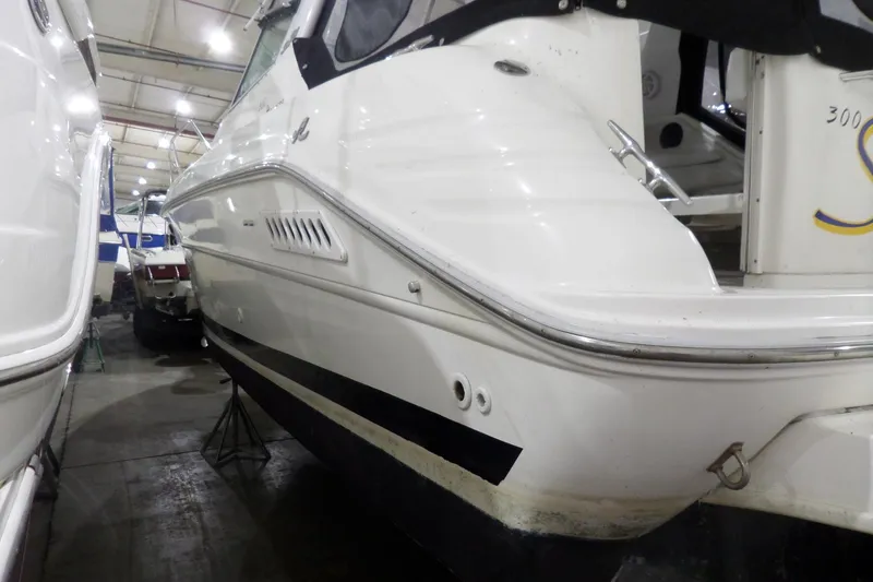 Slide: The Image of 1994 Searay 300 Weekender boat in indoor storage, side view. - 6