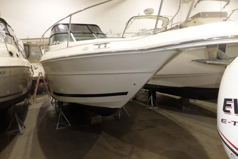 Slide: The Image of 1994 Searay 300 Weekender boat in indoor storage, side view. - 7