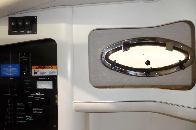 Slide: The Image of Control panel and porthole inside 1994 Searay 300 Weekender boat cabin. - 9