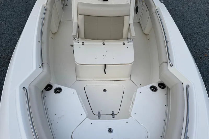 Slide: The Image of 2018 Boston Whaler 250 Outrage boat interior with seating and storage compartments. - 8