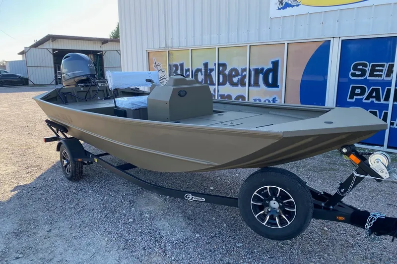Slide: The Image of 2026 G3 Gator Tough 17 CCJ boat on trailer, parked outside dealership. - 2