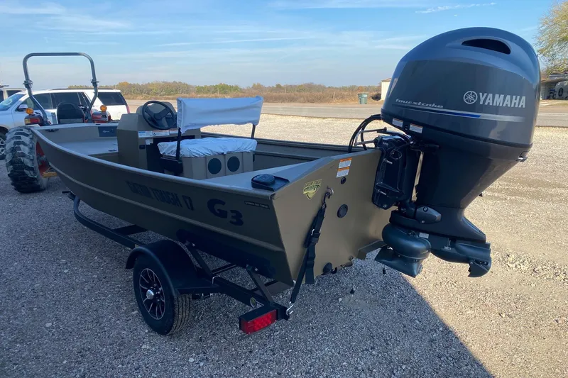 Slide: The Image of 2026 G3 Gator Tough 17 CCJ boat with Yamaha outboard motor on trailer. - 4