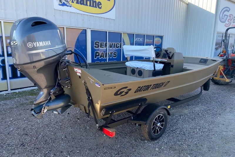 Slide: The Image of 2026 G3 Gator Tough 17 CCJ boat with Yamaha 65 HP engine on trailer. - 6