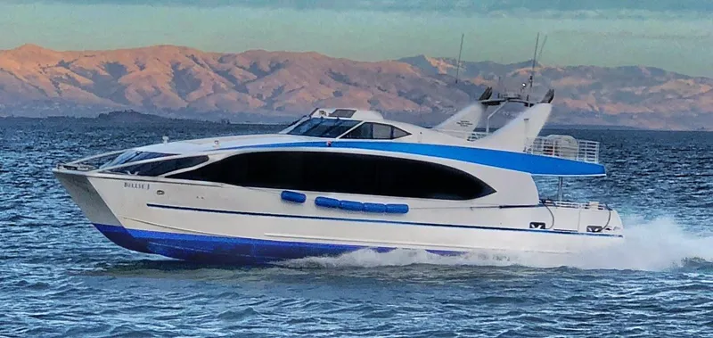 Slide: The Image of High-speed 2008 Custom passenger boat cruising on water with scenic mountain backdrop. - 15