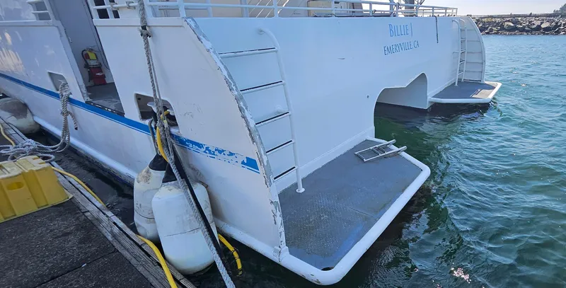 Slide: The Image of High-speed passenger boat docked, Custom model, 2008, with visible boarding platform and safety equipment. - 23