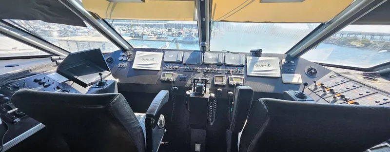 Slide: The Image of Cockpit of 2008 Custom High Speed 70pax COI Passenger vessel, featuring advanced navigation controls. - 26