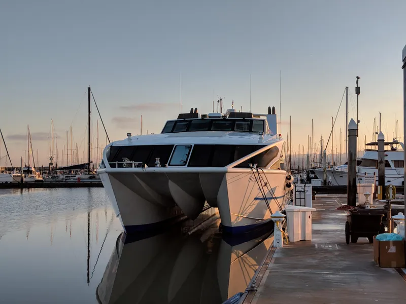 Slide: The Image of High-speed passenger ferry docked at marina, Custom model, 2008, serene sunset backdrop. - 8