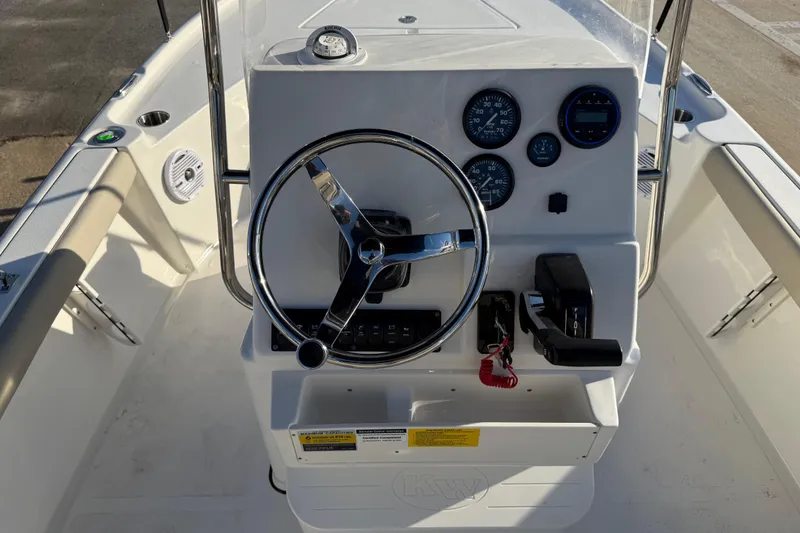 Slide: The Image of Steering console of 2026 Key West 188 Bay Reef boat with gauges and controls. - 13