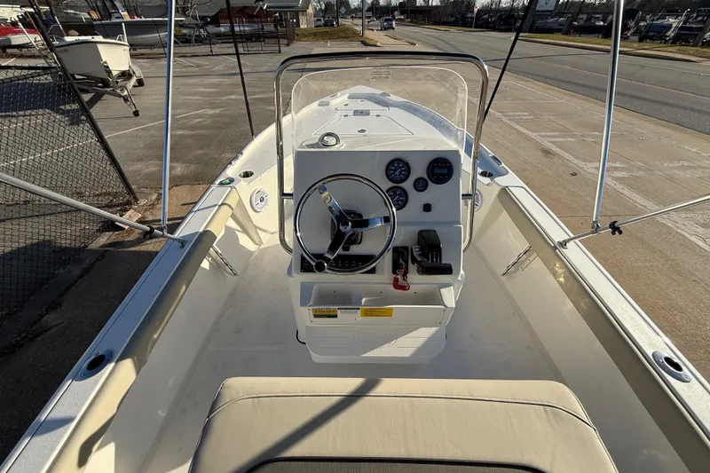 Slide: The Image of 2026 Key West 188 Bay Reef boat interior with steering console and gauges. - 14