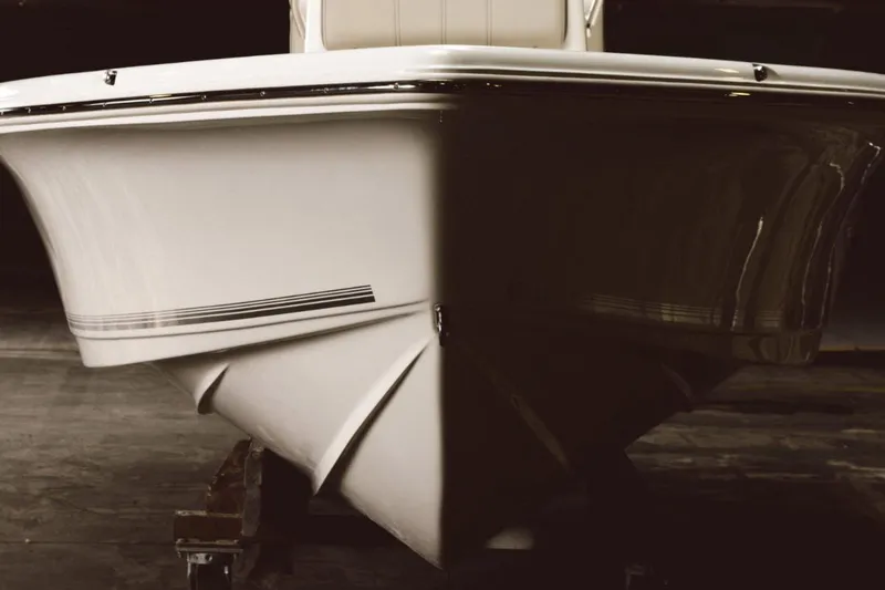 Slide: The Image of 2026 Key West 188 Bay Reef boat on trailer, parked outside dealership. - 2