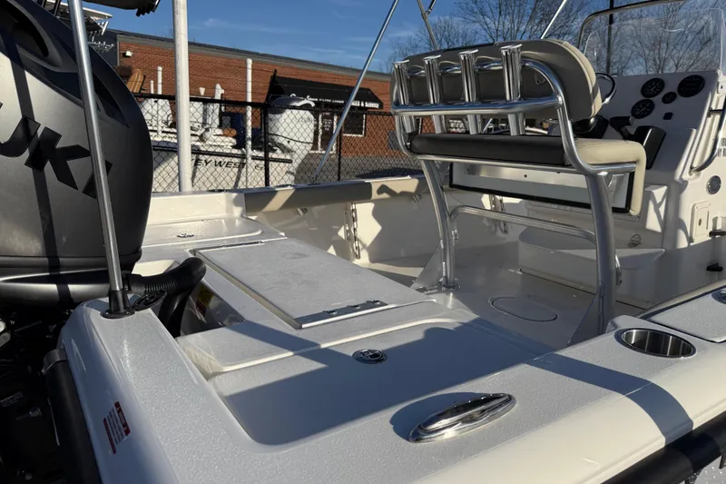 Slide: The Image of 2026 Key West 188 Bay Reef boat interior with Suzuki engine, featuring seating and control panel. - 21