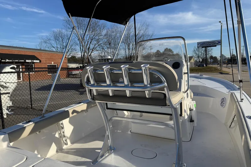 Slide: The Image of 2026 Key West 188 Bay Reef boat interior with seating and rod holders. - 22