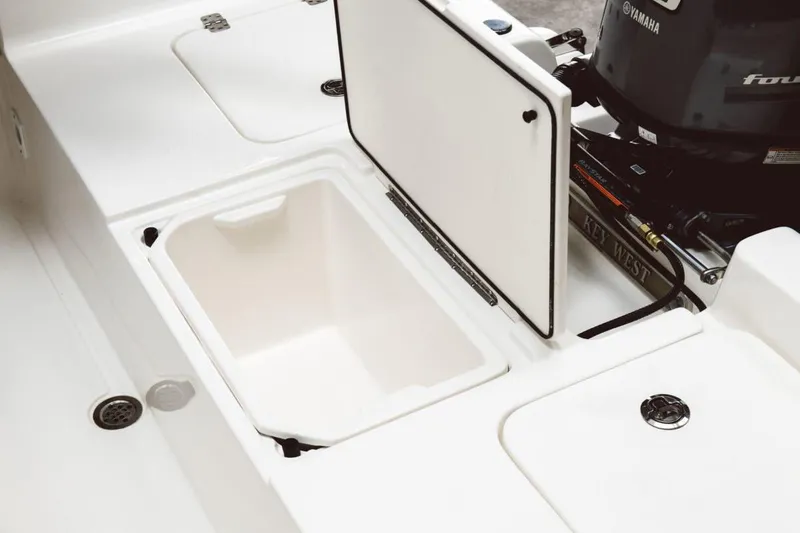 Slide: The Image of Storage compartment of 2026 Key West 188 Bay Reef boat, featuring a hydraulic lift. - 8