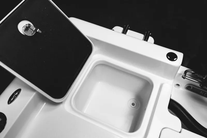 Slide: The Image of Livewell in 2026 Key West 188 Bay Reef boat, featuring a clean, blue interior. - 9