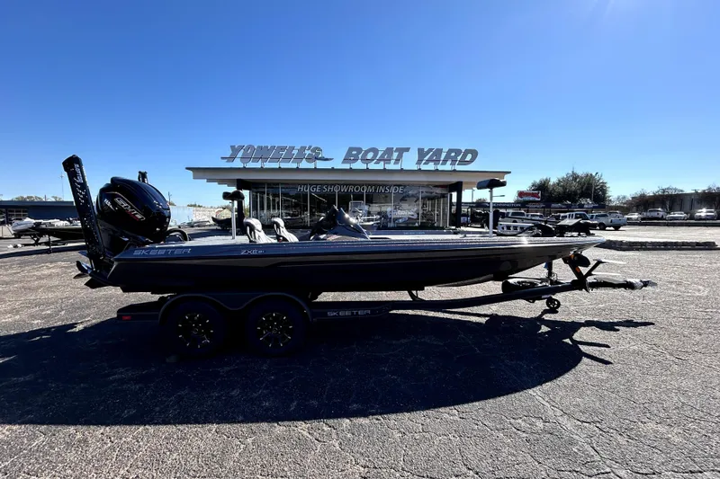 The Image of 2026 Skeeter ZXE21 boat at Yowell's Boat Yard under clear blue sky. - 0