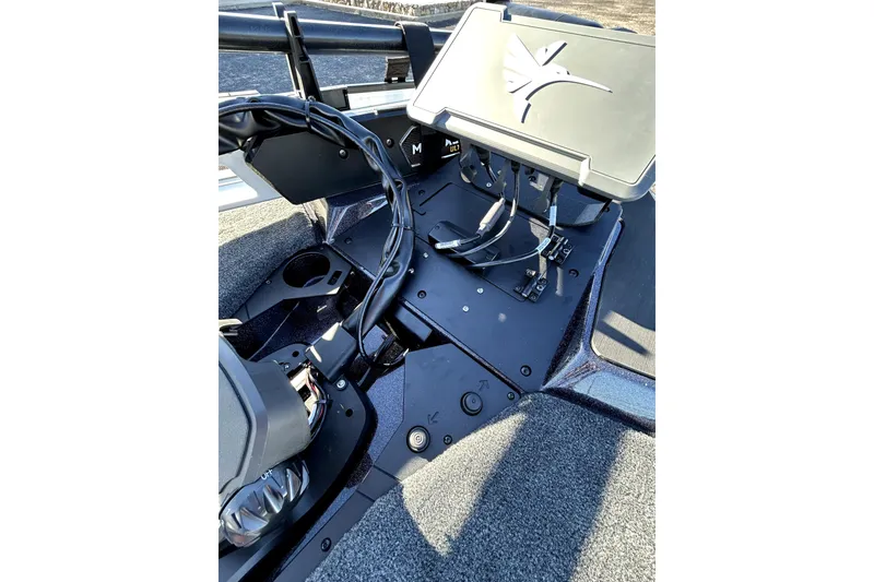 Slide: The Image of 2026 Skeeter ZXE21 boat dashboard with advanced navigation system and controls. - 11