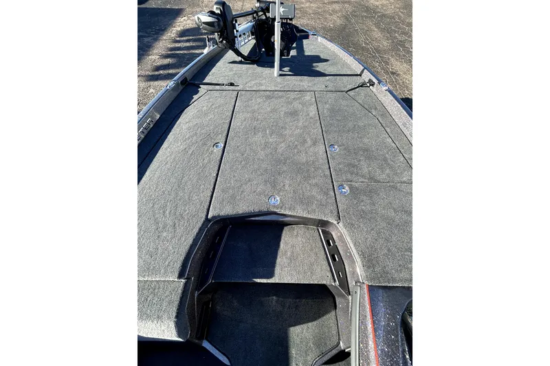 Slide: The Image of 2026 Skeeter ZXE21 boat deck with carpeted surface and storage compartments. - 14