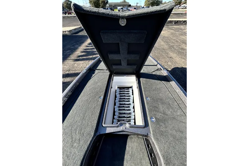 Slide: The Image of 2026 Skeeter ZXE21 boat with open storage compartment, showcasing organized interior layout. - 15