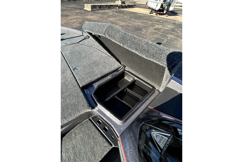 Slide: The Image of Open storage compartment on 2026 Skeeter ZXE21 boat, showcasing interior design and functionality. - 19