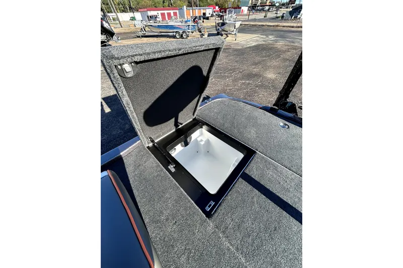 Slide: The Image of Open storage compartment on 2026 Skeeter ZXE21 boat, showcasing interior space. - 30