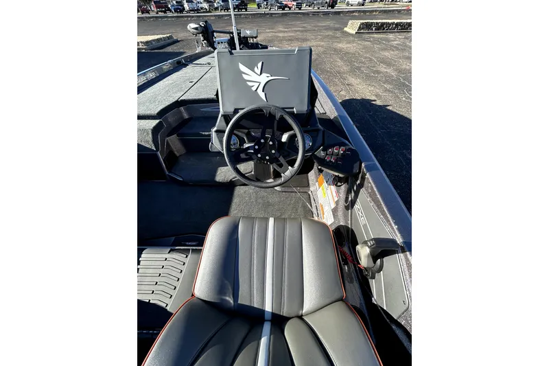 Slide: The Image of 2026 Skeeter ZXE21 boat interior with steering wheel and seating. - 38