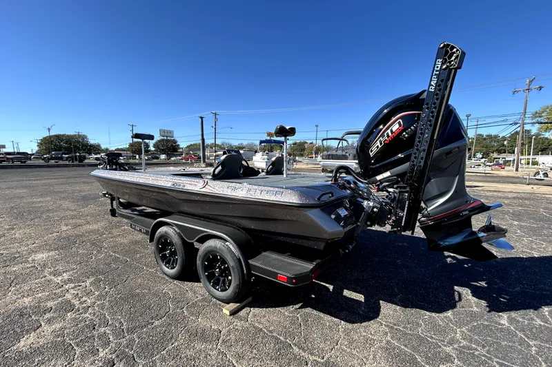 Slide: The Image of 2026 Skeeter ZXE21 boat with powerful outboard motor on a trailer in a parking lot. - 4