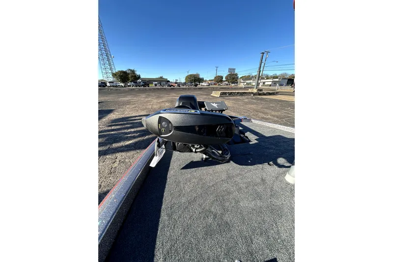 Slide: The Image of 2026 Skeeter ZXE21 boat on trailer in parking lot under clear blue sky. - 9