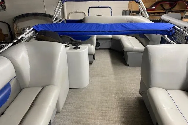 Slide: The Image of 2018 Bentley Pontoons 220/223 Cruise interior with gray seating and blue accents. - 6
