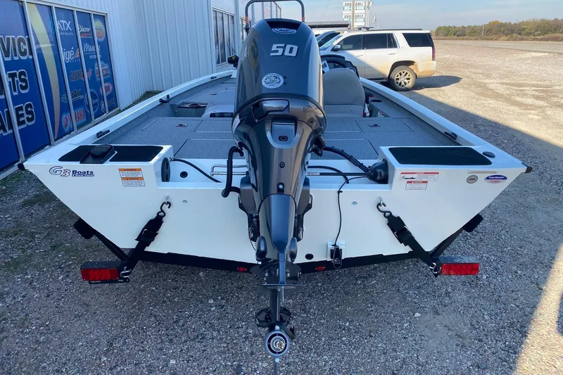Slide: The Image of 2026 G3 Sportsman 1610 boat with 50 HP motor, parked outdoors. - 5
